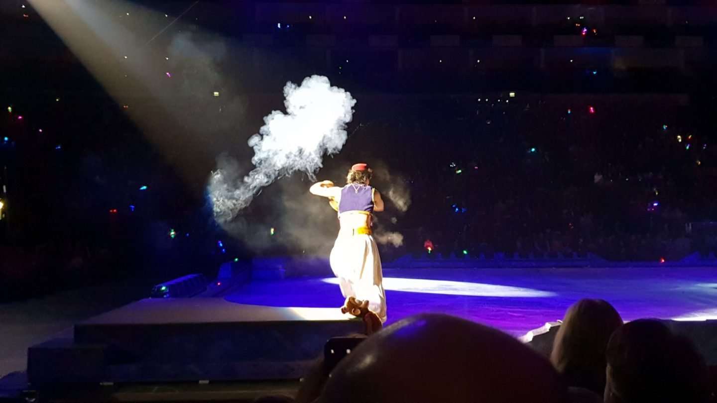 Aladdin summoning his Genie from the lamp